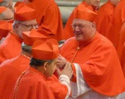 Cardinal Timothy M. Dolan is greeted by his brother cardinals at the Feb. 18, 2012 consistory in St. Peter's Basilica. CNA file photo.?w=200&h=150