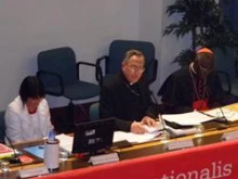 Lesley-Anne Knight, Cardinal Oscar Rodriguez Maradiaga, and Cardinal Robert Sarah speak at the Caritas meeting in Rome