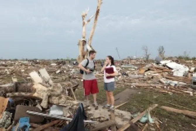 Carlos and Kim Caudillo stand in the debris of their home after a powerful tornado ripped through the area on May 20 2013 in Moore Okla Credit  Brett DeeringGetty Images CNA