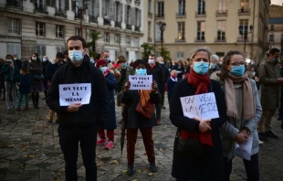 Catholics protest coronavirus restrictions under which public Masses are banned, Nov. 15, 2020, in Versailles.   Martin Bureau/AFP via Getty Images.