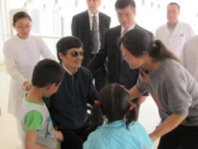 Chen Guangcheng meets his family at the Chaoyang hospital in Beijing as US Ambassador to China Gary Locke looks on. 