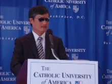 Chen Guangcheng announces his new Catholic University of America fellowship on October 2, 2013. 