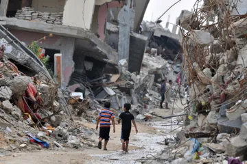 Children 2 amidst the devastated buildings in Gaza Credit Shareef Sarhan CRS CNA 7 22 15