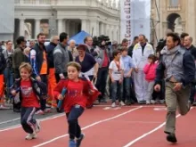 Children run during a Vatican sports event on Oct. 20, 2013. 