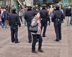 Chinese Police patrol near People's Square in Shanghai, China. ?w=200&h=150