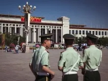 Chinese officers patrol Tiananmen Square in Beijing, where hundreds of pro-democracy protestors were killed June 4, 1989. 