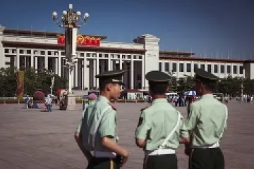 Chinese officers patrol Tiananmen Square May 29 2013 Credit Alexandre Kuma via Flickr CC BY NC SA 20 CNA 6 4 14