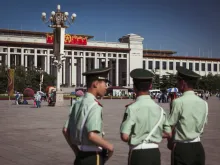 Officers patrol Tiananmen Square in Beijing, May 2013.