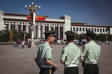 Chinese officers patrolling Tiananmen Square May 2013 China  Credit Alexandre Kuma via Flickr CC BY NC SA 20 CNA