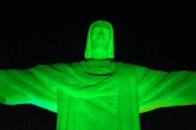 Christ the Redeemer statue lit up by green lights in Rio de Janerio Brazil Credit WYD Rio 2013 Organization CNA World Catholic News 2 8 12