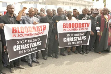 Christians hold signs as they march on the streets of Abuja during a prayer and penance for peace and security in Nigeria on March 1 2020 Credit  Public Domain