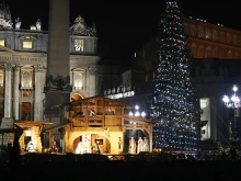 The Christmas tree and Nativity in St. Peter's Square are lit, Dec. 18, 2015. 