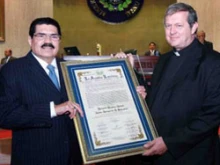 President of the Salvadoran General Assembly Ciro Cruz Zepedap and Monsignor Richard Antall pose with his award