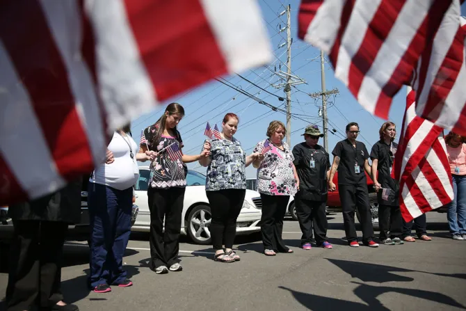 College students and others gather in prayer across the street where a gunman attacked a recruiting office in Chattanooga Tennessee on July 17 2015 Credit Getty Images CNA 7 17 15
