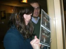 A married couple signs the postcard from the Colorado Catholic Conference at Holy Name parish in Sheridan, Colo. on Jan. 15, 2012