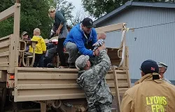 Colorado National Guardsmen assist Boulder County authorities evacuate residents of Lyons, CO Sept. 13, 2013. ?w=200&h=150
