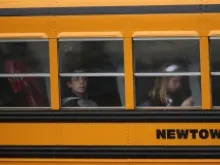 Children return to school Dec. 18, 2012 four days after the attack in Newtown, Conn. 