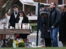 A makeshift memorial outside St. Rose of Lima Catholic Church draws mourners on Dec. 16 after the mass shooting at Sandy Hook Elementary in Newtown.