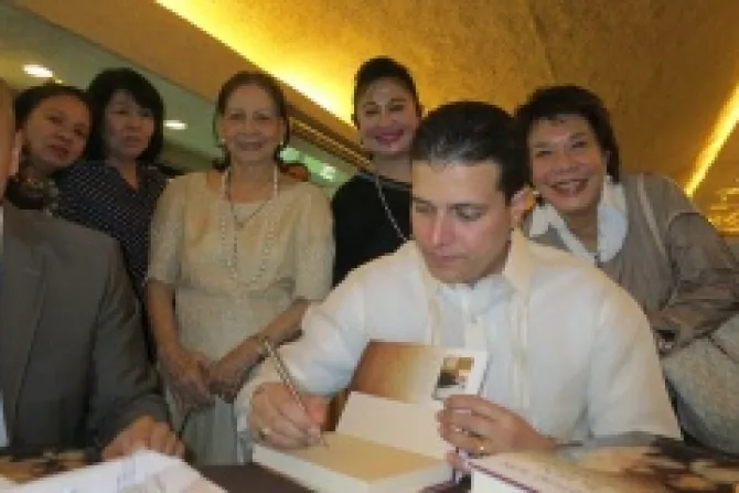 Costa Rican Ambassador Fernando Filippe Sanchez Campos signs copies of his new book in Philippines Credit Jo Ann Lara CNA 4 11 14