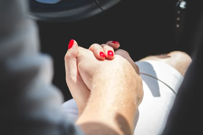 Couple holding hands Credit Shutterstock CNA