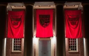 Crimson banners hang outside Memorial Church on the campus of Harvard University in Cambridge, Mass., Sept. 6, 2012.   Tim Sackton via Flickr (CC BY-SA 2.0).