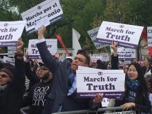 Crowds hold signs in defense of traditional marriage at the March for Marriage in Washington, D.C. on Saturday. 