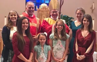 Deacon Drake McCalister, his family, and Bishop Jeffrey Montforton. Courtesy photo. 