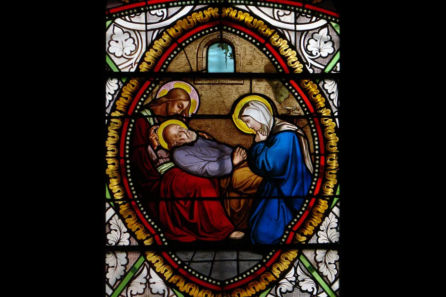 Death of St. Joseph, from the stained glass at St Martin parish in Florac, France.?w=200&h=150