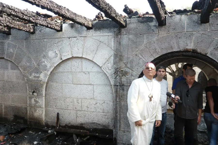 Fouad Twal, then-Patriarch of Jerusalem, inspects damage to the Church of the Multiplication from the June 18, 2015 arson attack. ?w=200&h=150