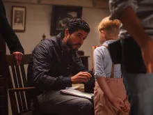 Director Alejandro Monteverde speaks with Jakob Salvati on the set of the movie Little Boy. Courtesy Metanoia Films.