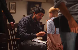 Director Alejandro Monteverde speaks with Jakob Salvati on the set of the movie Little Boy. Courtesy Metanoia Films. 
