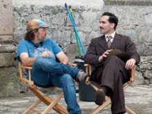 Director Dean Wright speaks to actor Nestor Carbonell on set. Courtesy of Pistache Media / Newland Films