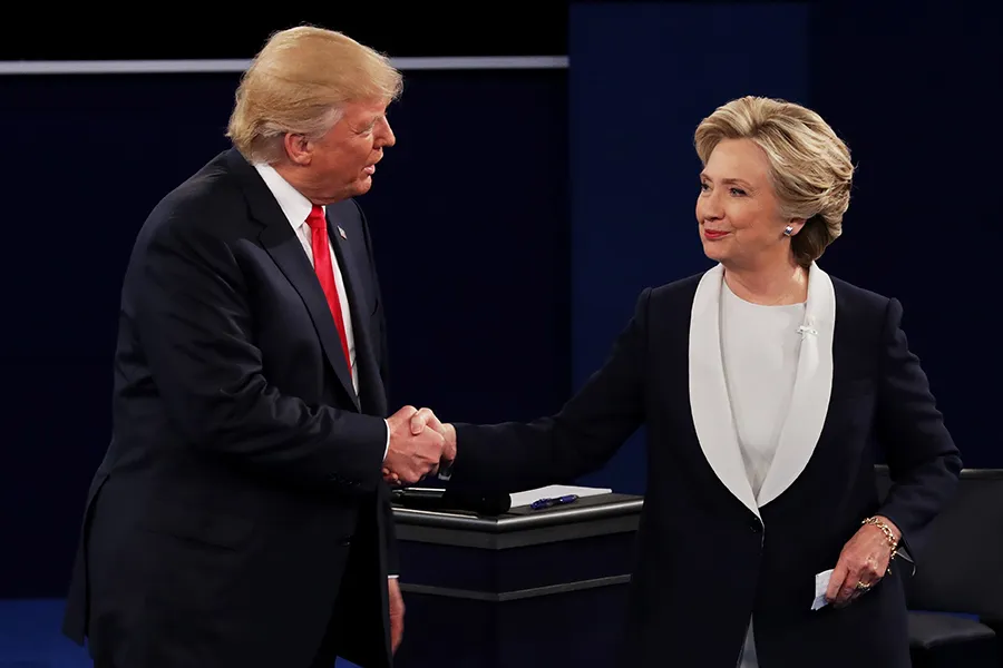 Donald Trump shakes hands with Hillary Clinton during the town hall debate at Washington University on October 9, 2016. ?w=200&h=150