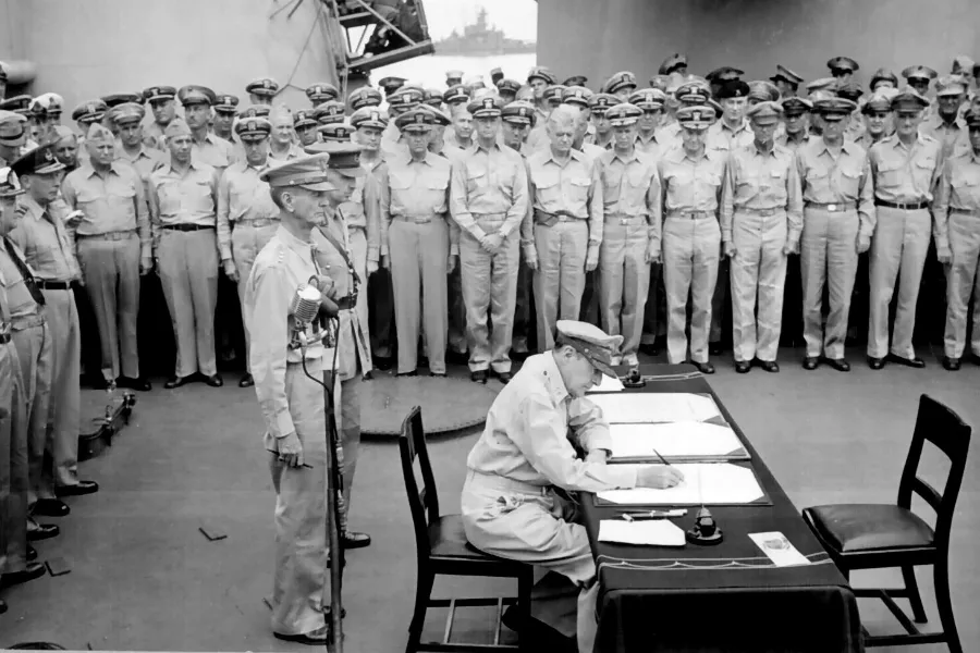 Douglas MacArthur, a US general, signs the Japanese Instrument of Surrender aboard the USS Missouri, Sept. 2, 1945, formally ending World War II. ?w=200&h=150