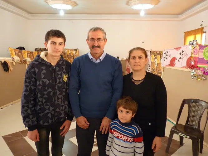 Imad Ibraheem Daood with his wife Sajida and their four children, in a refugee center in Amman. ?w=200&h=150