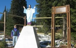 Dr. Raymond Leopold stands next to the 10th Mountain Division war memorial known as the Montana Jesus Statue. ?w=200&h=150