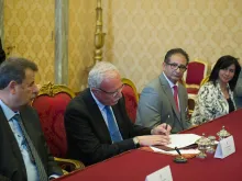 Riad al-Malki, Palestine's foreign minister, signs the Comprehensive Agreement between the State of Palestine and the Holy See, June 26, 2015. 