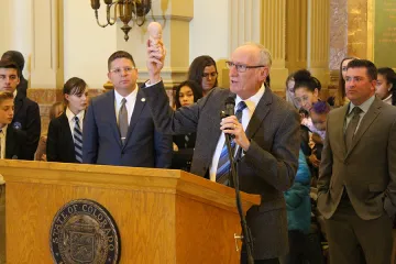 Dr Tom Perille president of Colorados chapter of Democrats for Life displays a model of a seven month old fetus at the Colorado State Capitol on Feb 11 2020