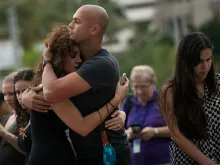 Mourners at a memorial for the victims of the Orlando shooting. 