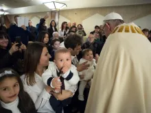 Pope Francis baptizes babies from earthquake zones in Italy at the chapel of Santa Marta. 
