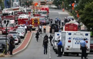 Emergency vehicles and law enforcement personnel respond to shots at the Washington Navy Yard Sept. 16, 2013.   Alex Wong/Getty Images News/Getty Images.