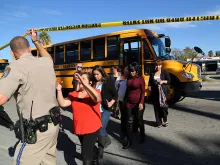Employees evacuated by bus from site of mass shootings at Inland Regional Center in San Bernardino, Calif. on Dec. 2, 2015. 