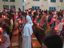 Faithful in India's Miao diocese pray in a candlelight vigil for persecuted Christians in the Middle East, March 1, 2015. 