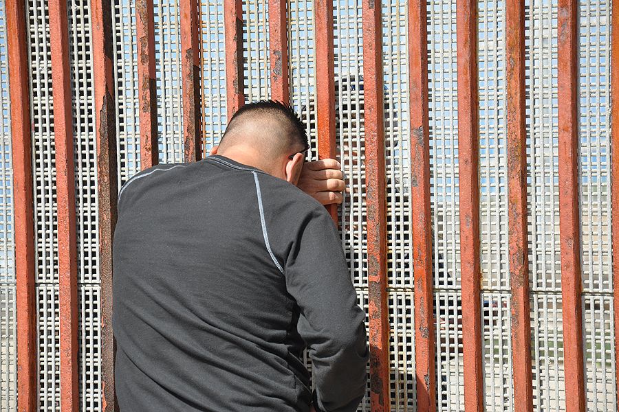 Families meet through the border fence. ?w=200&h=150