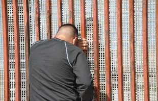 Families meet through the border fence.   BBC World Service via Flickr (CC BY-NC 2.0).