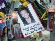 Fans pay tribute to actor Paul Walker on Dec. 1, 2013 at the site of his fatal car accident in Valencia, CA. 
