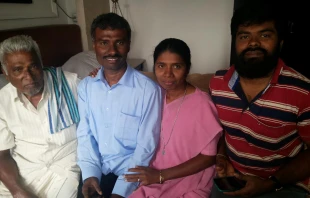 Fr. Alexis Prem Kumar (second from left) seen with his family after his release, February 2015.   Jesuit Refugee Service.