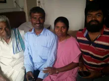 Fr. Alexis Prem Kumar (second from left) seen with his family after his release, February 2015. 
