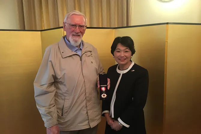 Father Jude McKenna holds his Order of the Rising Sun Award alongside Japans Ambassador to Ireland Mari Miyoshi Credit  Embassy of Japan in Ireland