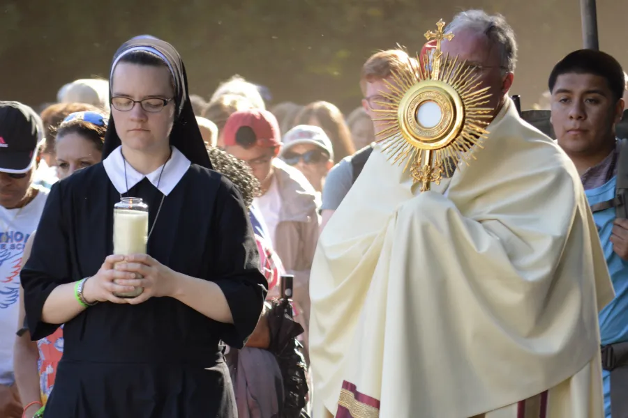 Father Timothy Christy, vicar general for the Diocese of Metuchen, leads the Eucharistic Procession for the last three miles of the Sept. 21 walking pilgrimage. ?w=200&h=150